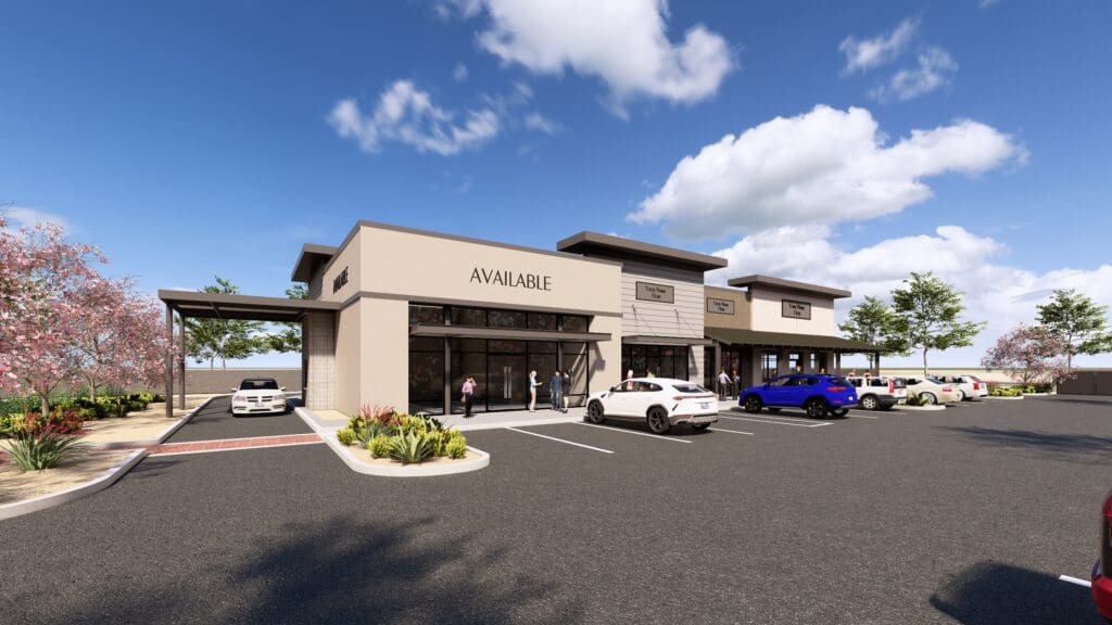 Modern retail building at The Shops at Marley Park with palm trees and parking area.