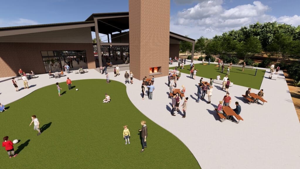 Outdoor green space at Marley Park with families gathering for an event.