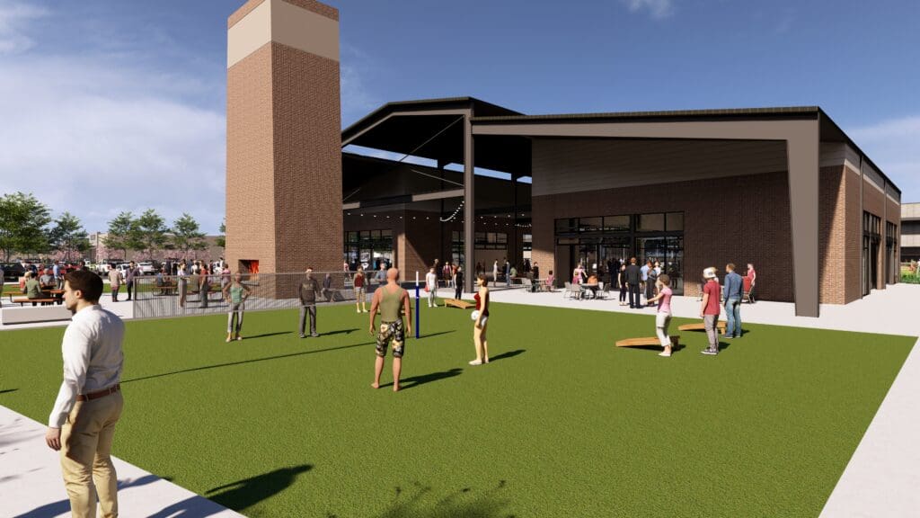 Community lawn at The Shops at Marley Park with people enjoying the green space.