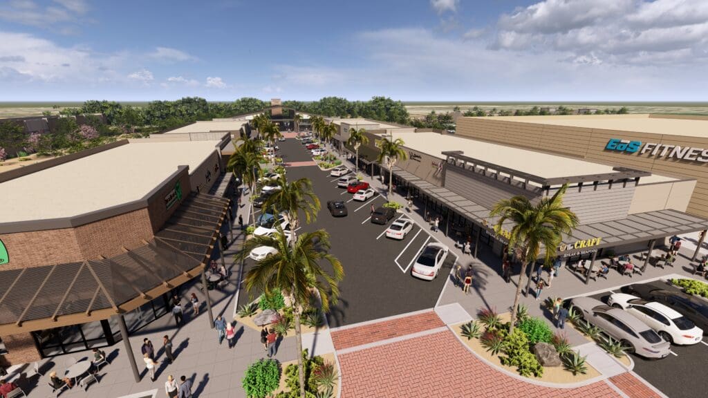 Aerial view of palm-lined main street and parking areas at Marley Park Square.