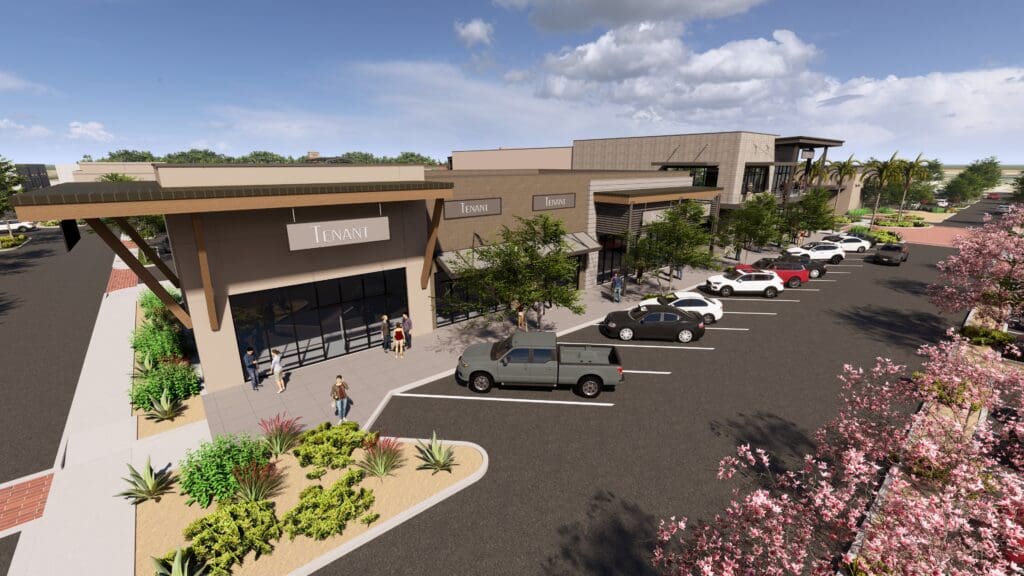 Front view of retail and dining buildings with parking at The Shops at Marley Park.